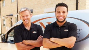 N-Hance franchise two men stand in front of van